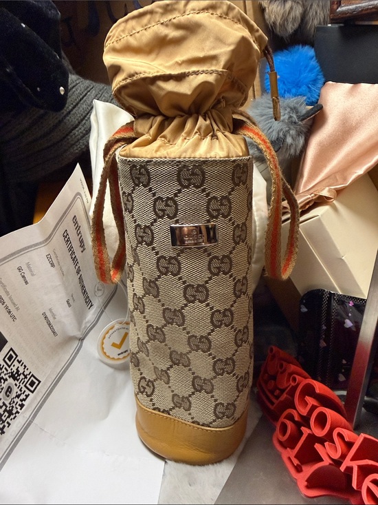 Gucci Handbags - Gucci Beige GG Monogram Drawstring Mini Water Bottle Bag with Tan Trim